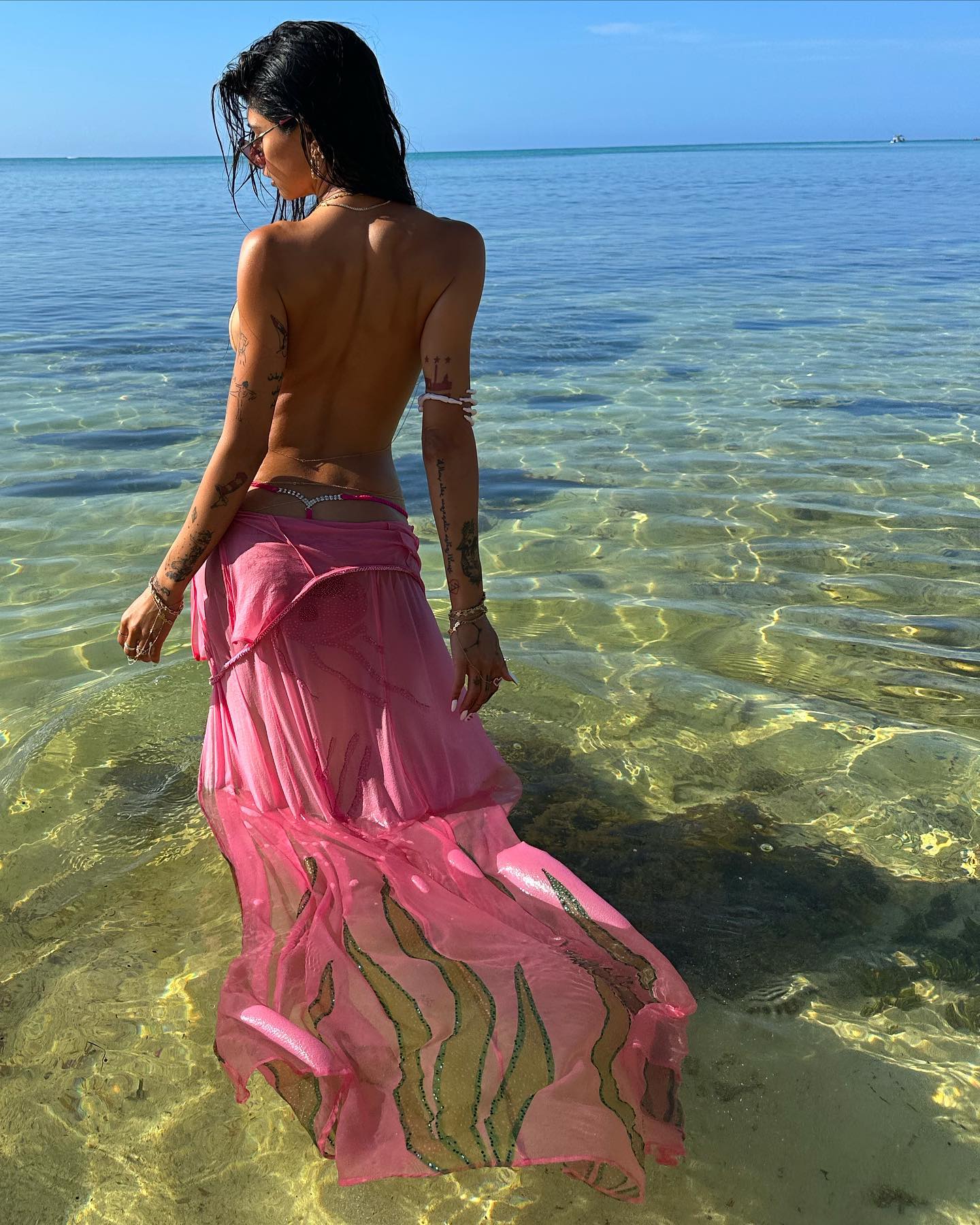 mia khalifa looks hot in sexy pink dress in ocean